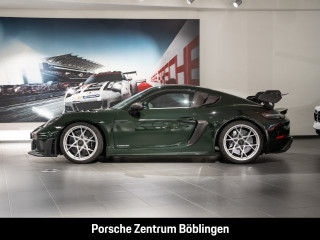 Fahrzeugbild eines Porsche Cayman in grün.