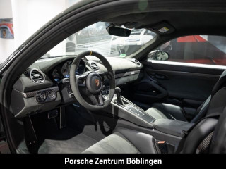 Fahrzeugbild eines Porsche Cayman in grün.