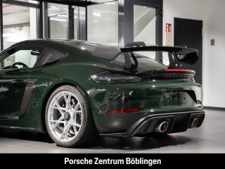 Fahrzeugbild eines Porsche Cayman in grün.