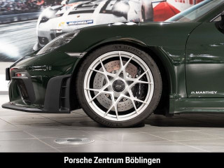 Fahrzeugbild eines Porsche Cayman in grün.