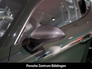 Fahrzeugbild eines Porsche Cayman in grün.