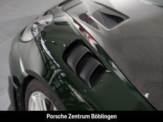 Fahrzeugbild eines Porsche Cayman in grün.