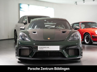 Fahrzeugbild eines Porsche Cayman in grün.