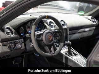 Fahrzeugbild eines Porsche Cayman in grün.