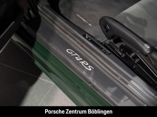 Fahrzeugbild eines Porsche Cayman in grün.