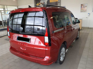 Fahrzeugbild eines Volkswagen Caddy in rot.