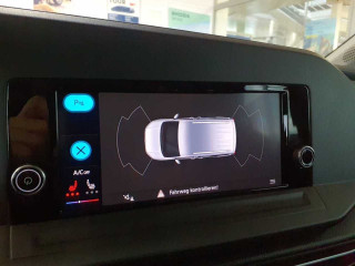 Fahrzeugbild eines Volkswagen Caddy in rot.